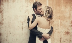 all-down-wedding-hair-loose-waves-bride-groom-kiss__full-carousel