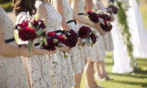 lace-printed-bridesmaids-dresses-black-sash-red-bouquets__full-carousel