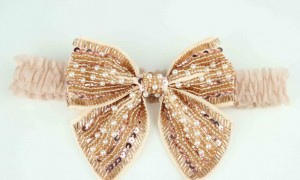 gold-beaded-bridal-garter-bows-2012-wedding-trend__full